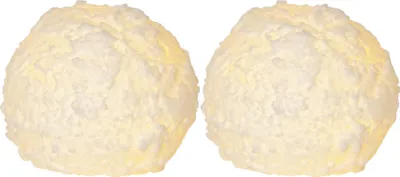 Two white, textured spherical objects resembling snowballs, lit from within.