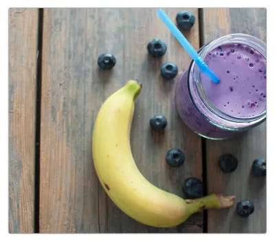 Produktbild von Spritzschutz Herdabdeckplatte Schneidebrett aus Glas Banane und Smoothie 1-Teilig (60x52cm)