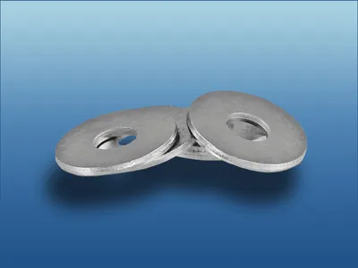 A stack of metal washers on a gradient blue background.