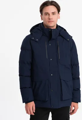A man wearing a navy winter jacket.