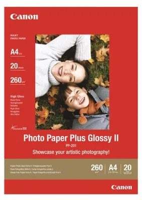 A product packaging for Canon Photo Paper Plus Glossy II, featuring two smiling children lying on grass with autumn leaves.