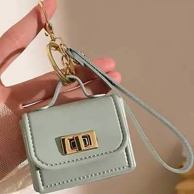 Immagine prodotto di Elegante Portachiavi Mini Borsetta Turchese - Accessorio Pratico e Chic KP41038, Immagine generata dall'IA