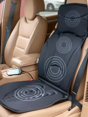 A massage seat mat is placed on a car seat.