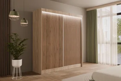A bedroom scene featuring a large wardrobe with slatted doors, illuminated by LED lighting. A plant in a white pot and two pendant lights are also visible.