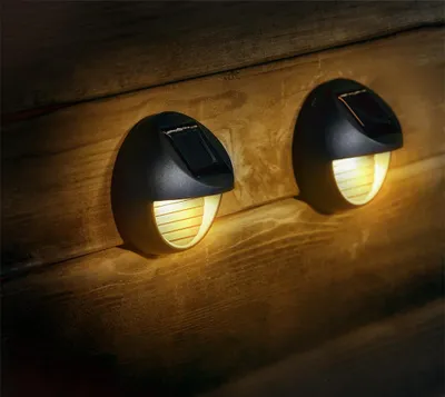 Produktbild von 2 x LED Solar runde Wandleuchte Fassadenleuchte für den Außenbereich  in schwarz | 80 x 45mm (B. x H.) | 6 Lumen | Warmweiß (2700 K)