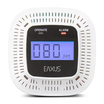 A white carbon monoxide detector with a digital display and indicator lights.