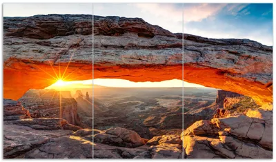 Produktbild von Wallario Herdabdeckplatte aus Glas, Größe 90 x 52 cm 3-teilig, Motiv Sonnenstrahl am Horizont  Leuchtende Felsspalte