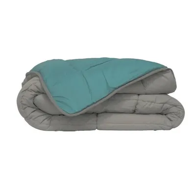 A folded comforter with a teal top and gray underside.