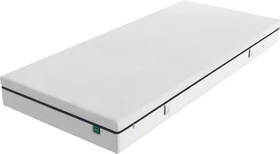 A white mattress is shown from a diagonal angle on a white background.