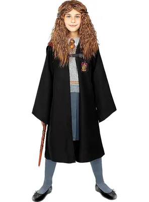 A young girl dressed as Hermione Granger from Harry Potter stands against a white background.