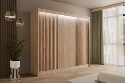 A bedroom scene featuring a large wooden wardrobe with slatted doors and integrated LED lighting.