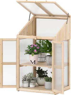 A wooden greenhouse with plants on shelves, shown against a white background.