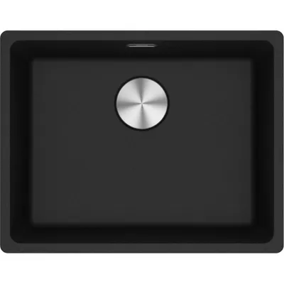 A top-down view of a black kitchen sink with a silver drain cover.