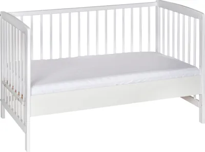 A white crib with a white mattress on a white background.