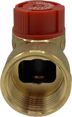 A close-up of a brass valve with a red cap.