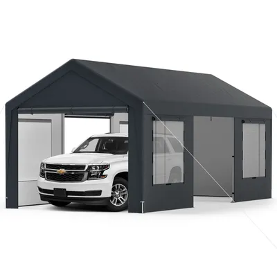 A white SUV is parked inside a dark gray tent garage.