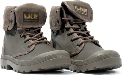 A pair of Palladium boots are shown against a white background.