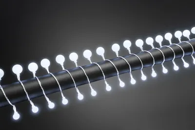 Produktbild von Konstsmide - LED Globelichterkette, kleine & große runde Dioden, 80 kalt weiße Dioden, 24V Außentrafo, transparentes Kabel; 3680-203