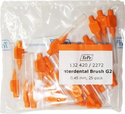 A clear plastic bag containing multiple orange interdental brushes.