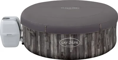 A round inflatable hot tub with a gray cover and a wood-grain patterned base, attached to a white control unit.