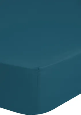 A close-up, angled view of a teal fitted sheet.