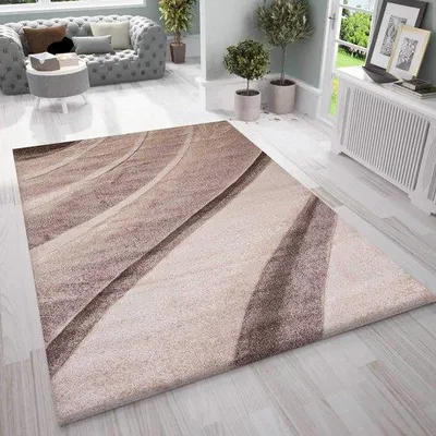 Zdjęcie produktu dla Dywani do salonu Unyqoos®, stylowy wzór falisty w kolorach brązowym i beżowym, wymiary 120 x 170 cm, 100% polipropylenu, wysokość włosa ok. 12 mm, przędza przypominająca wełnę
