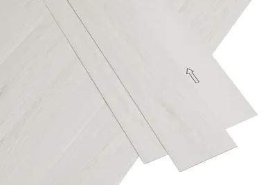 Vinylboden mit selbstklebender Rückseite in Creme-Weiß.
