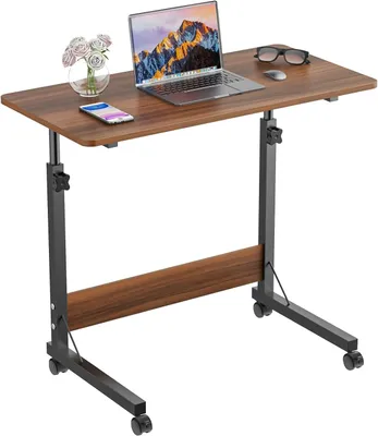 A mobile laptop desk with a laptop, phone, and flowers on top, shown against a white background.
