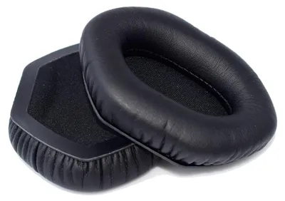 Two black headphone ear pads are shown on a white background.