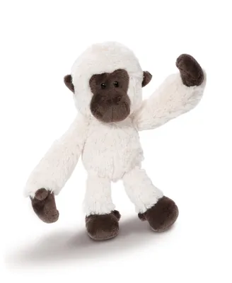 A stuffed toy gibbon against a white background.