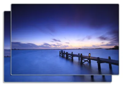 Produktbild von Wallario Frühstücksbrettchen 2er Set aus Glas, je 20 x 30 cm, mit rutschfesten Füßen, Motiv Steg bei Abenddämmerung - Blauer Himmel bei Nacht