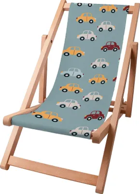 A close-up of a foldable wooden deck chair with a colorful car pattern on the fabric.