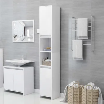 A clean, modern bathroom with white furniture and grey tiled walls.
