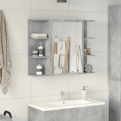 A bathroom vanity with a mirror and shelves, showing toiletries and towels.