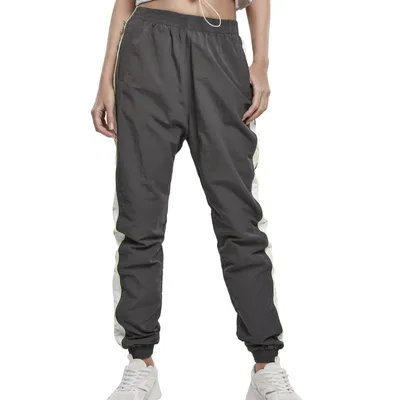 Obrázok produktu pre Dámske nohavice Urban Classics Ladies Piped Track Pants darkshadow/electriclime - XL