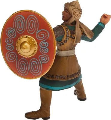 A figurine of a soldier holding a shield.