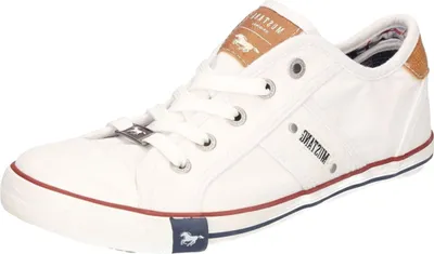 A white canvas sneaker with brown accents and red and blue trim.