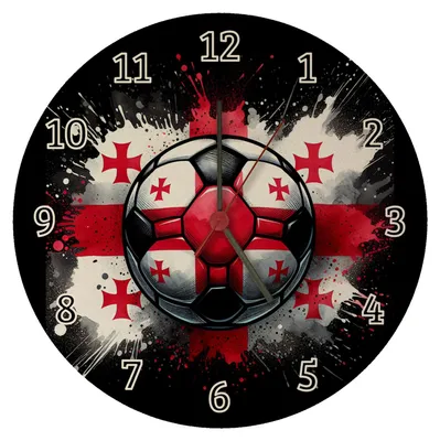 A round wall clock with a black background, featuring a soccer ball with the Georgian flag design in the center. The clock has numbers from 1 to 12 around the edge and hands indicating the time.