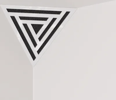 A triangular acoustic foam panel with a patterned insert, placed in the corner of a room.