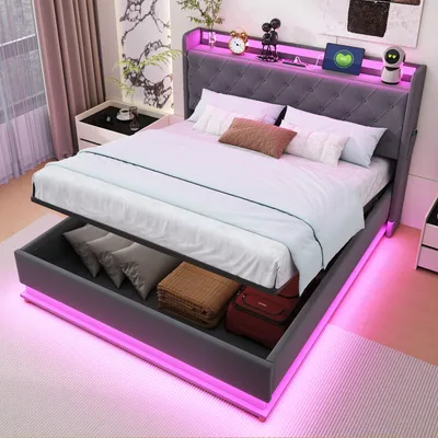 A modern bedroom with a grey upholstered bed frame with built-in storage and LED lighting.