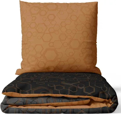 A folded duvet and pillow with a geometric pattern.