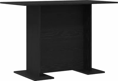 A black wooden dining table against a white background.