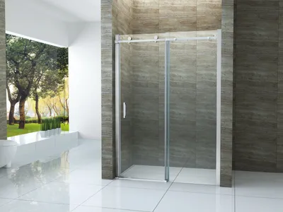 A modern bathroom with a glass shower enclosure and a view of trees outside.