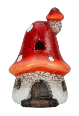 Pilzhaus mit LED. Hut des Pilzes ist leuchtend rot mit weißen Punkten und orangefarbenen Akzenten