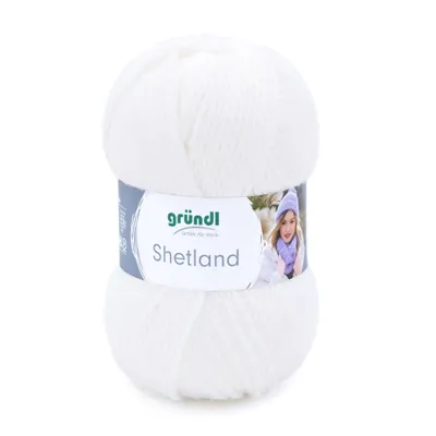 A ball of white yarn with a label showing a person wearing a hat and scarf.