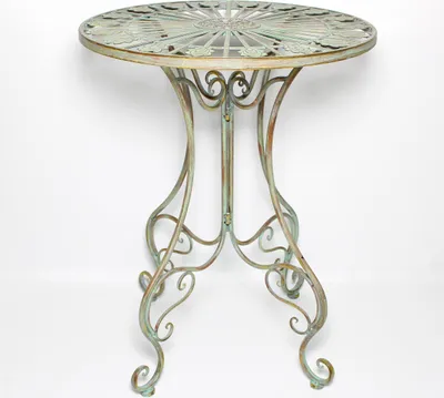 A round metal table with ornate legs and a decorative top, shown against a white background.