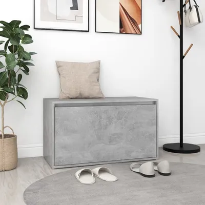 A hallway scene with a bench, plant, coat rack, and slippers.