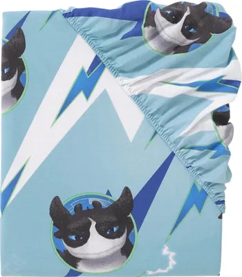 A folded fitted sheet with a cartoon dragon pattern.