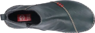 A top-down view of a single green boot.