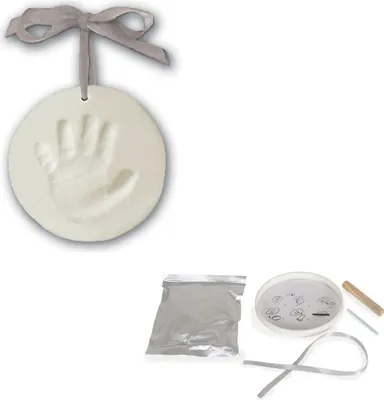 A handprint ornament kit with its components laid out.